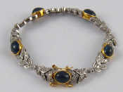 Appraisal: A yellow and white metal tests carat gold sapphire and