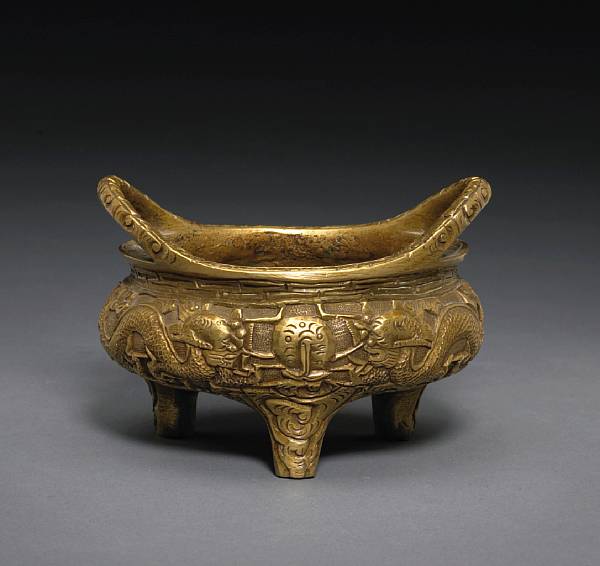 Appraisal: A bronze tripod censer Xuande Mark Of compressed globular form