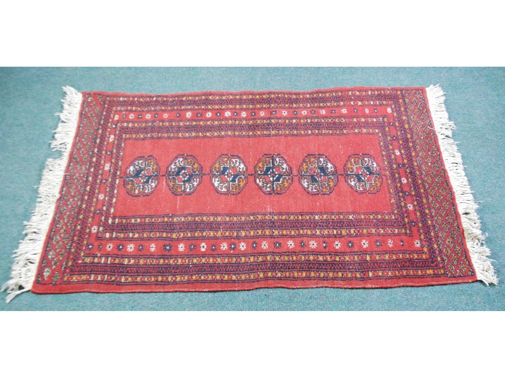 Appraisal: PAKISTAN BOKHARA RUG With a single row of six guls