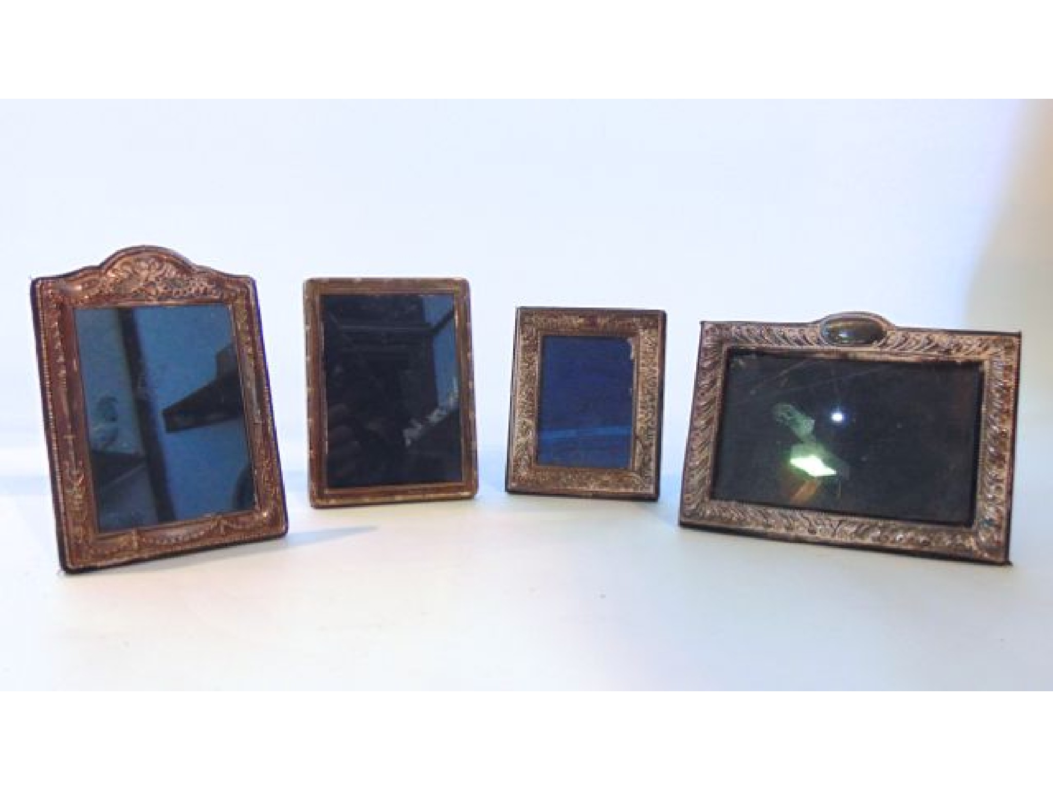 Appraisal: A miscellaneous collection of four silver photo frames various makers