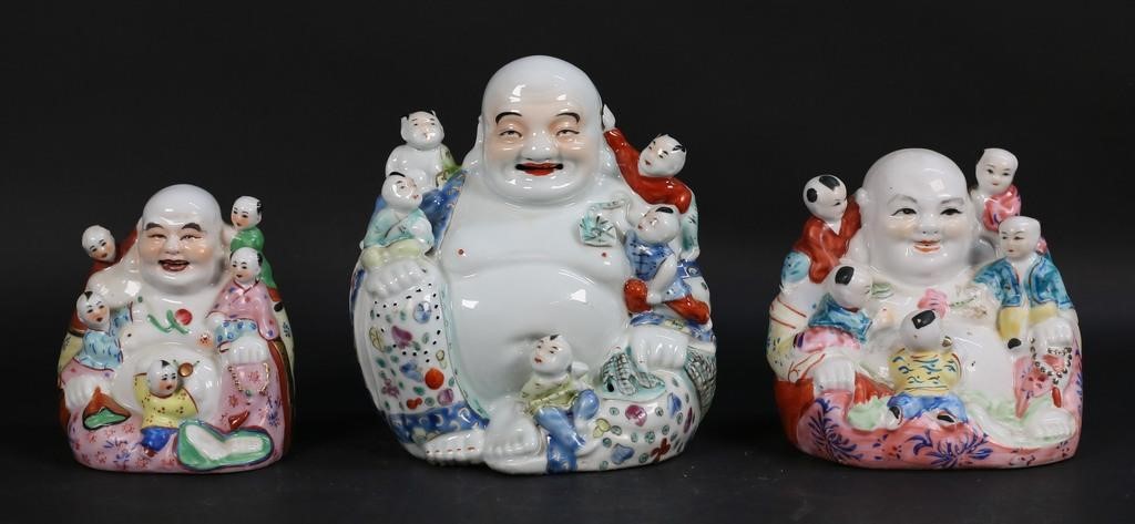 Appraisal: CHINESE HAPPY BUDDHA FERTILITY PORCELAIN FIGURES Chinese porcelain figures each