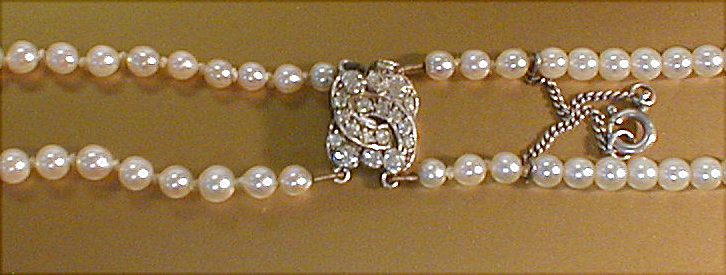 Appraisal: A double strand graduated cultured pearl necklace with white metal