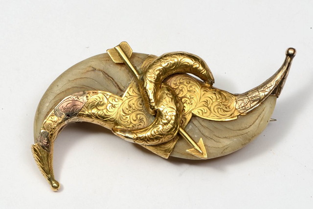 Appraisal: A VICTORIAN TIGER CLAW BROOCH with applied yellow metal mounts