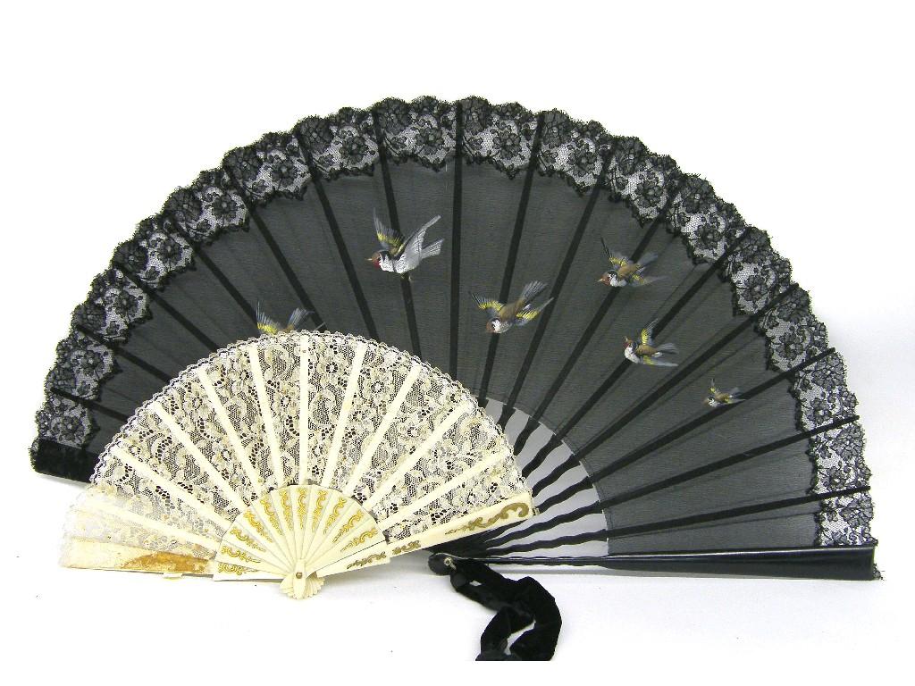 Appraisal: Black lace fan decorated with flying birds within a floral