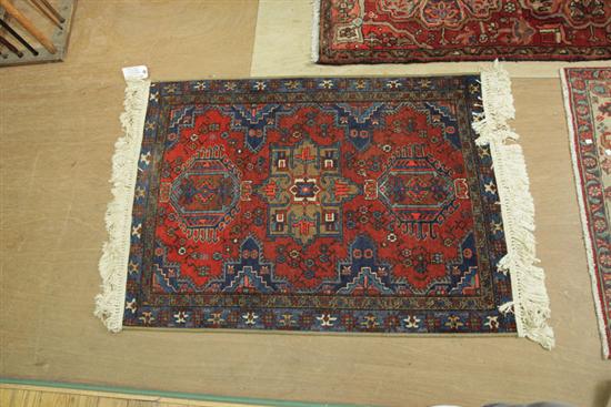 Appraisal: ORIENTAL RUG Hand knotted with three hooked medallions on a