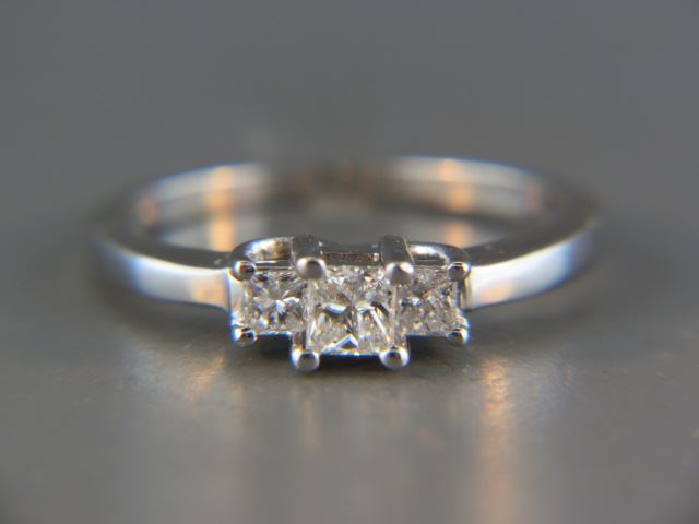 Appraisal: Diamond Ring a trio of square diamonds totaling carat in