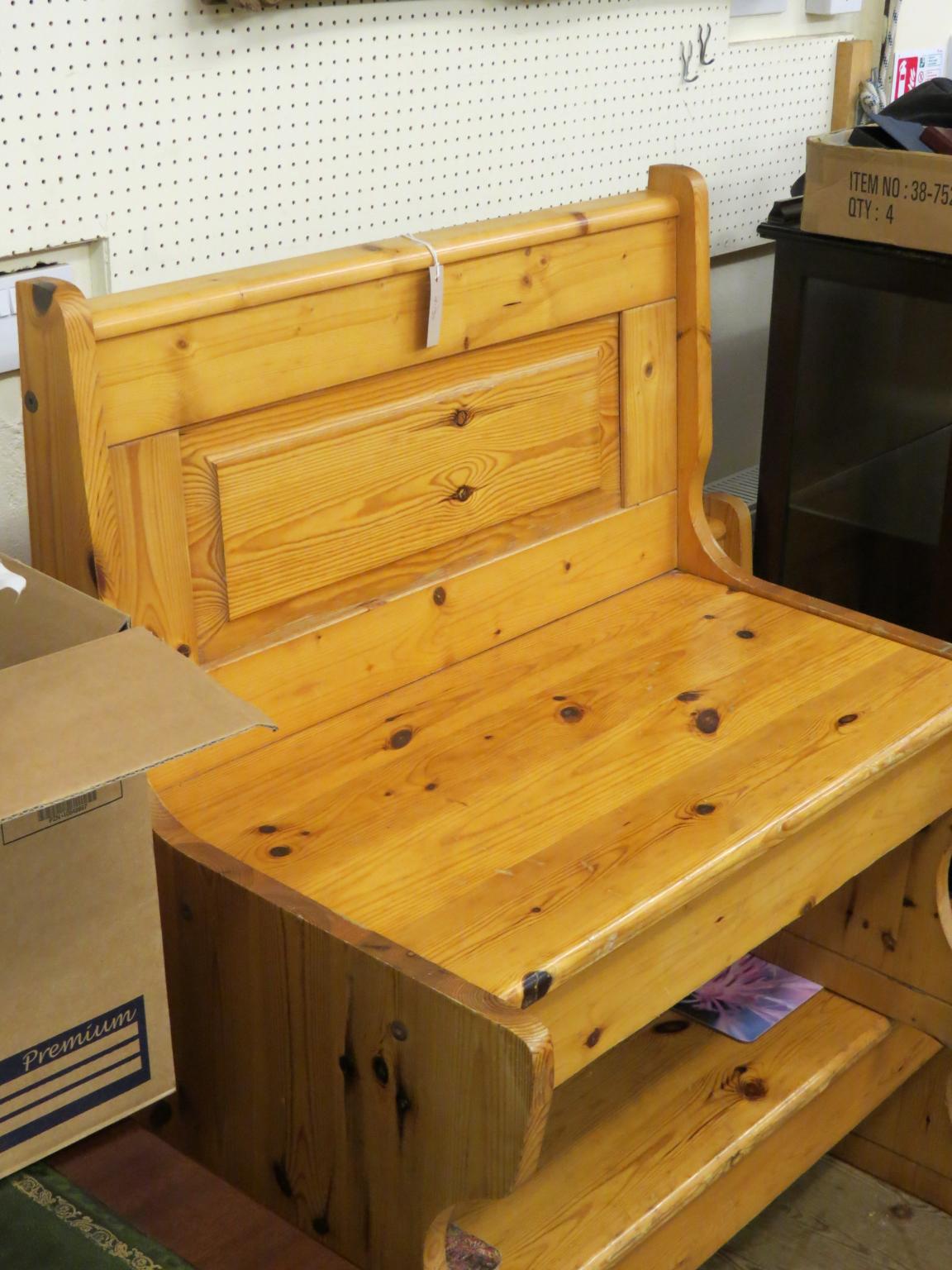 Appraisal: Two waxed pine benches panelled backs above hinged seats ft