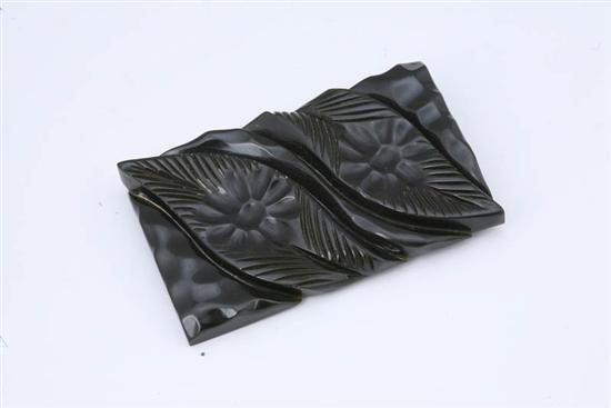 Appraisal: BAKELITE BROOCH Deep navy blue black brooch with carved leaves