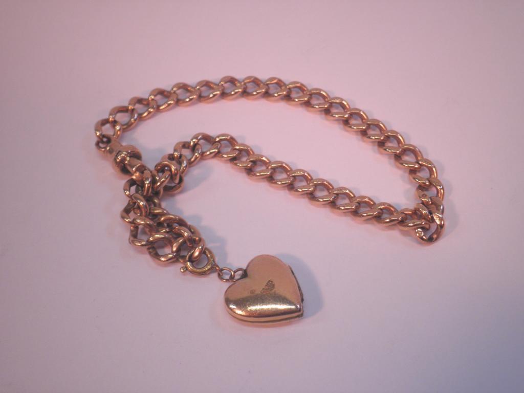 Appraisal: A yellow metal bracelet with rolled gold heart shaped locket