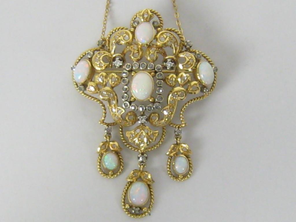 Appraisal: A Continental Opal and Diamond Pendant Brooch the scrolled openwork