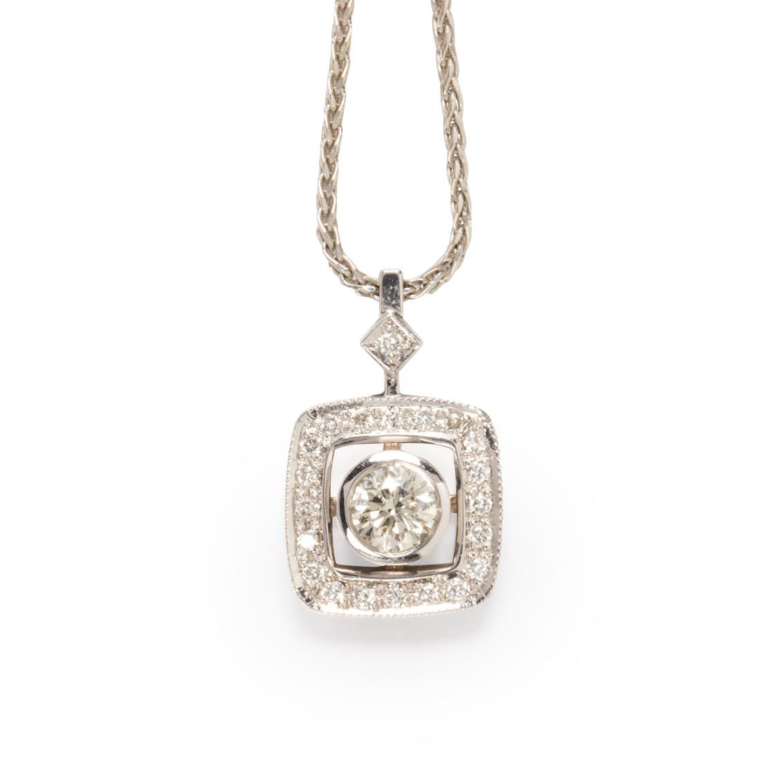 Appraisal: A DIAMOND AND FOURTEEN KARAT WHITE GOLD PENDANT NECKLACE A