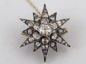 Appraisal: A Victorian gold and silver diamond star pendant with detachable