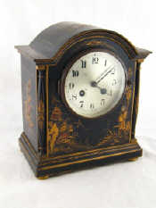 Appraisal: A Chinese lacquer finished mantel clock with eight day chiming