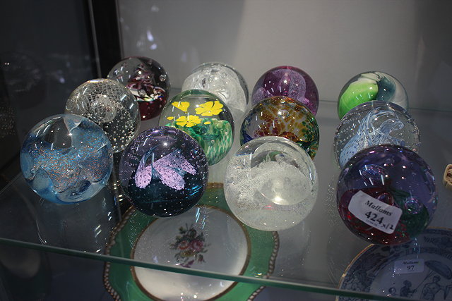 Appraisal: A GROUP OF CAITHNESS PAPERWEIGHTS to include 'Tempest' 'Wild Flower