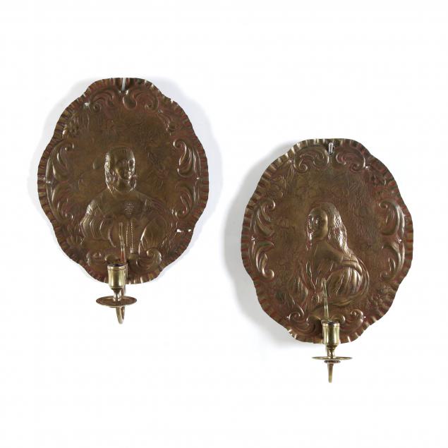 Appraisal: PAIR OF CONTINENTAL BRASS FIGURAL WALL SCONCES th century oval