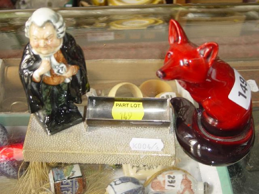 Appraisal: A Royal Doulton flambe model of a seated fox signed