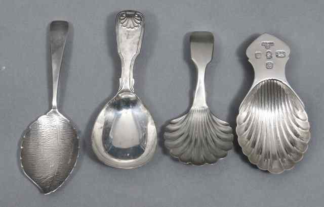 Appraisal: A CONTEMPORARY SILVER CADDY SPOON with scallop shell bowl London