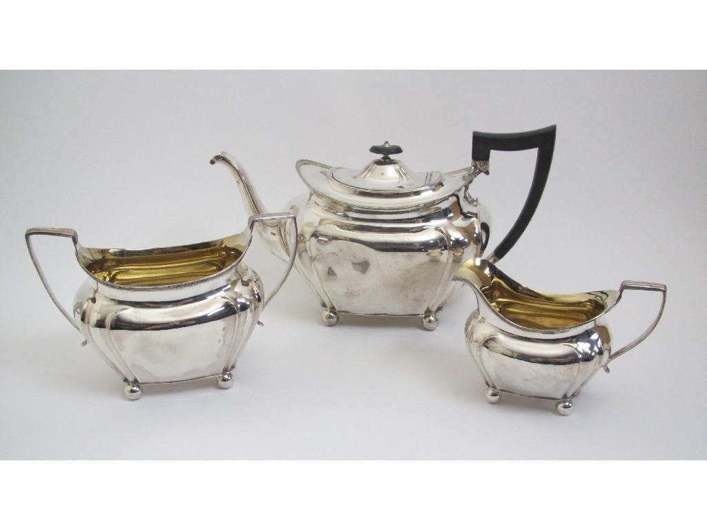 Appraisal: A three piece silver tea service of rounded rectangular form