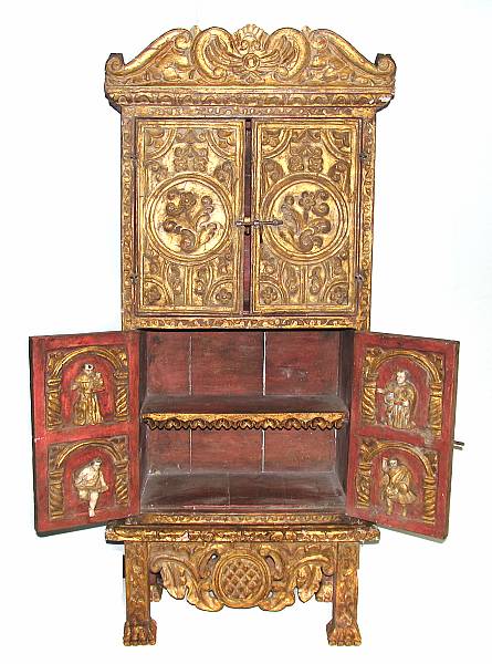 Appraisal: A Spanish Colonial carved giltwood cabinet on stand height ft