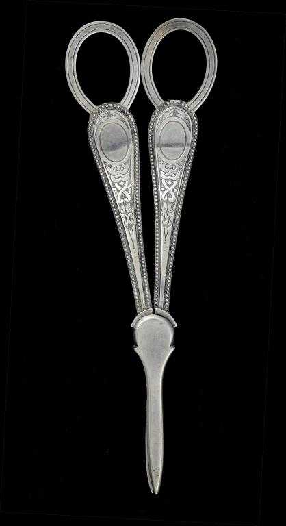 Appraisal: A PAIR OF VICTORIAN GRAPE SHEARS engraved with strapwork by