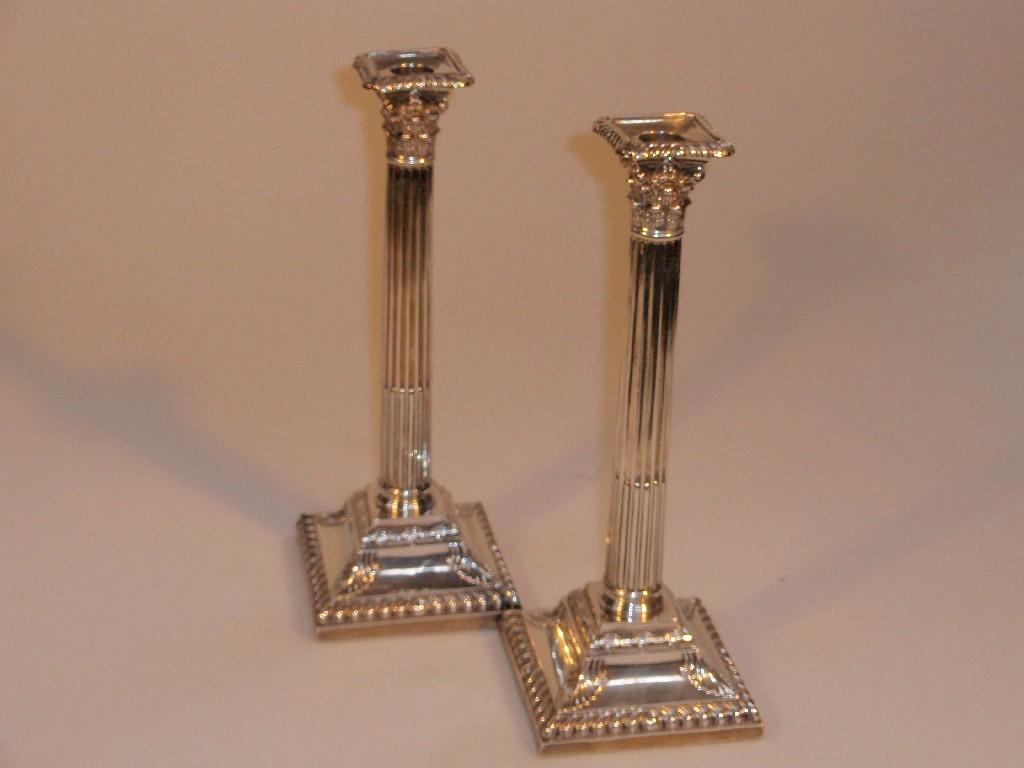 Appraisal: A pair of Victorian silver Corinthian columnar candlesticks Maker H