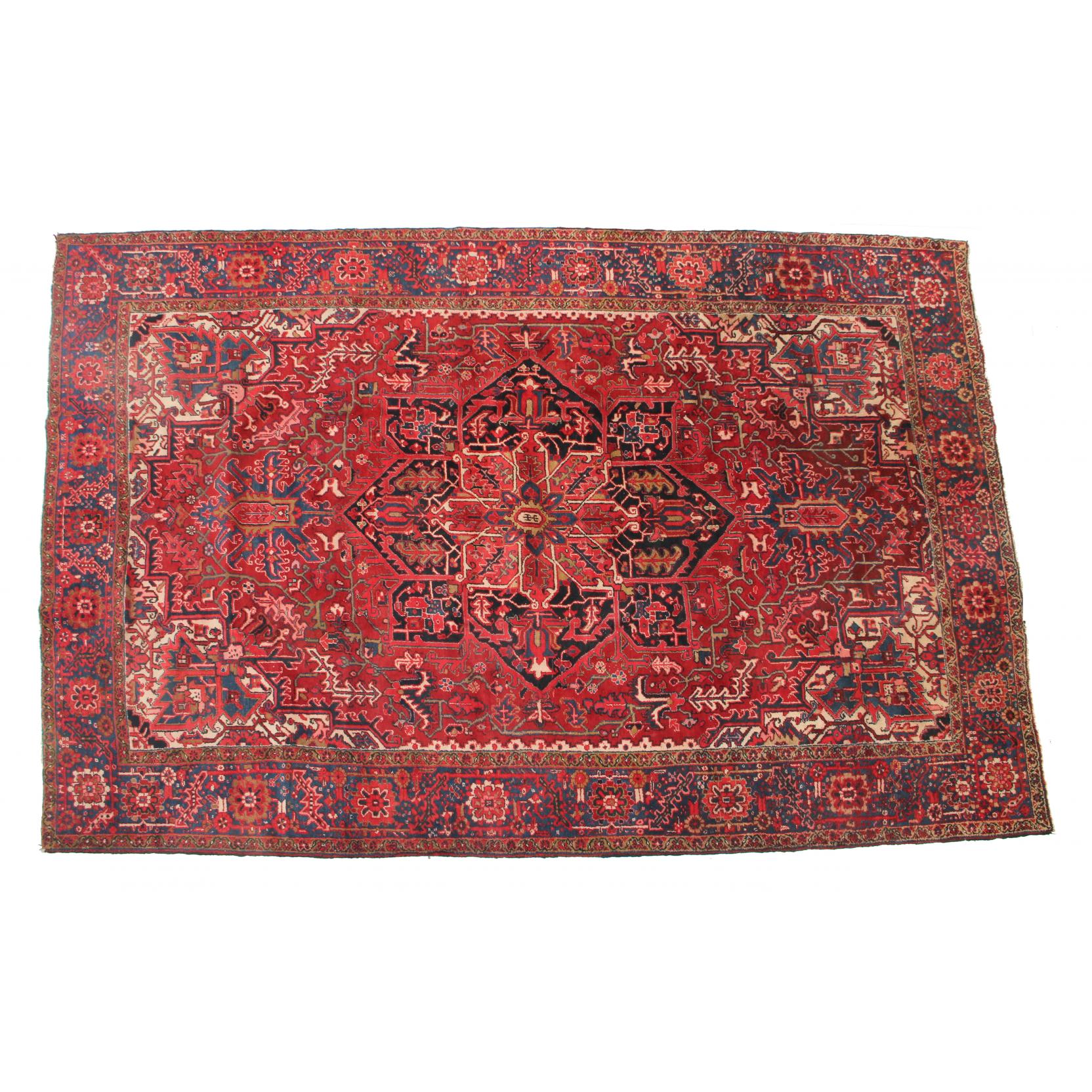 Appraisal: Persian Heriz Rug the center blue medallion on red field