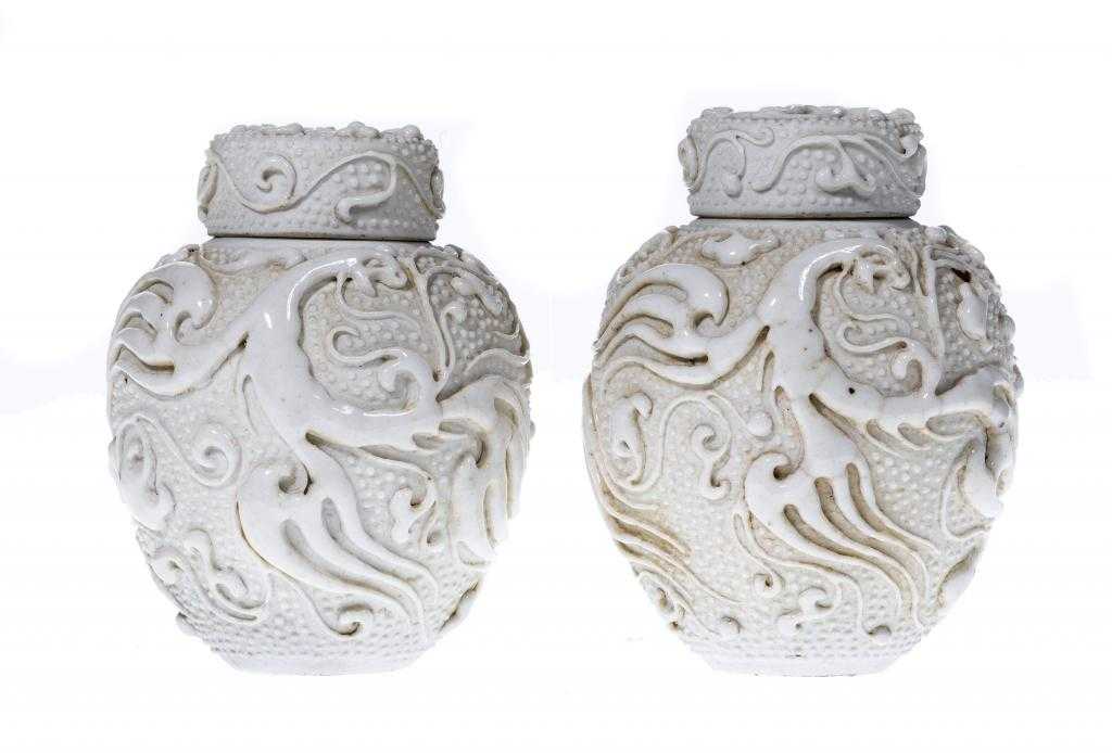 Appraisal: A PAIR OF CHINESE WHITE GLAZED PORCELAIN TEA CANISTERS AND