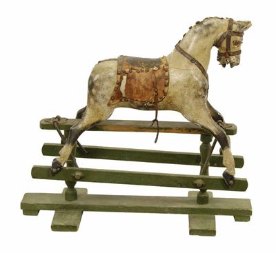 Appraisal: A carved wood and painted dapple grey rocking horse on