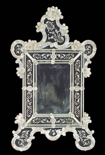 Appraisal: A Venetian Rococo style etched and molded glass mirror first