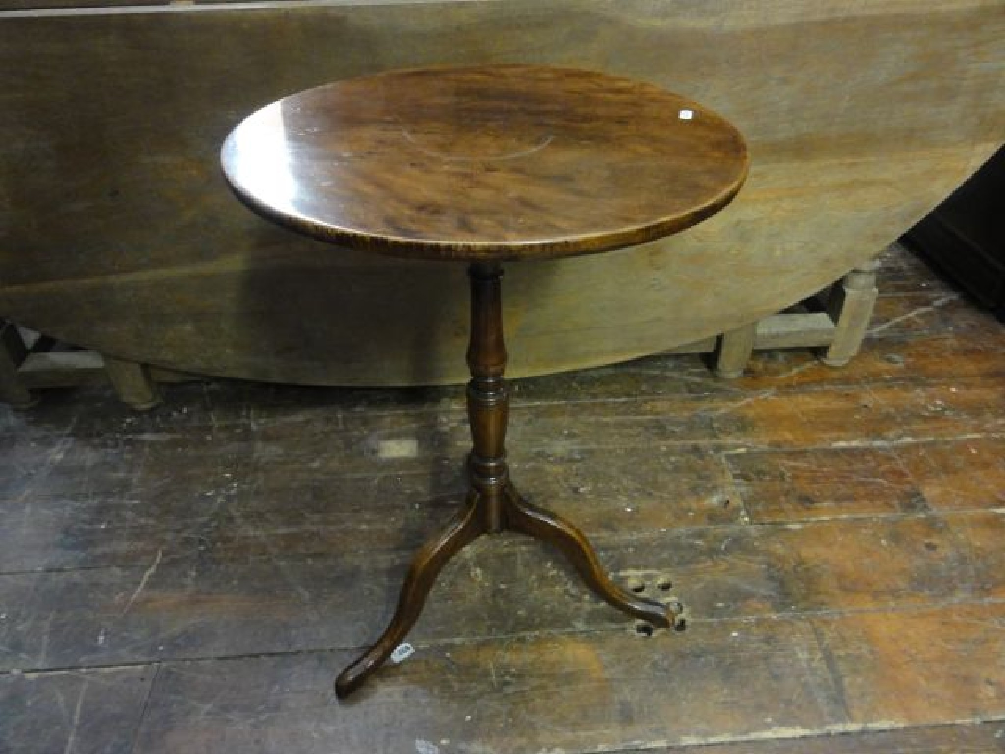 Appraisal: A Georgian mahogany occasional table of circular form raised on