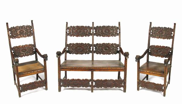 Appraisal: A Renaissance style carved oak three piece suite of seat