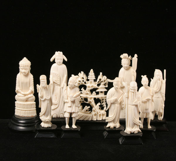 Appraisal: Carved elephant ivory figures six smaller pieces on bases two