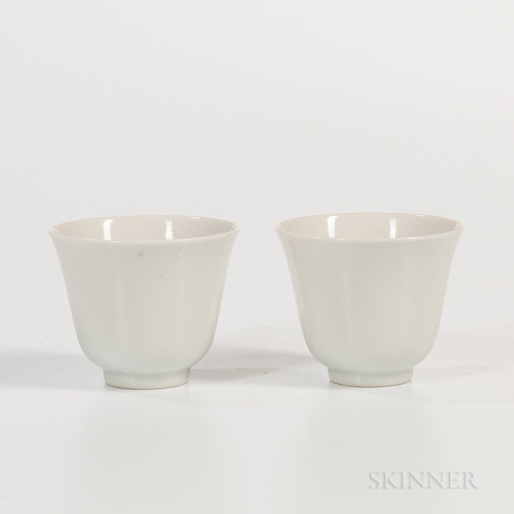 Appraisal: Pair of White Porcelain Wine Cups Pair of White Porcelain