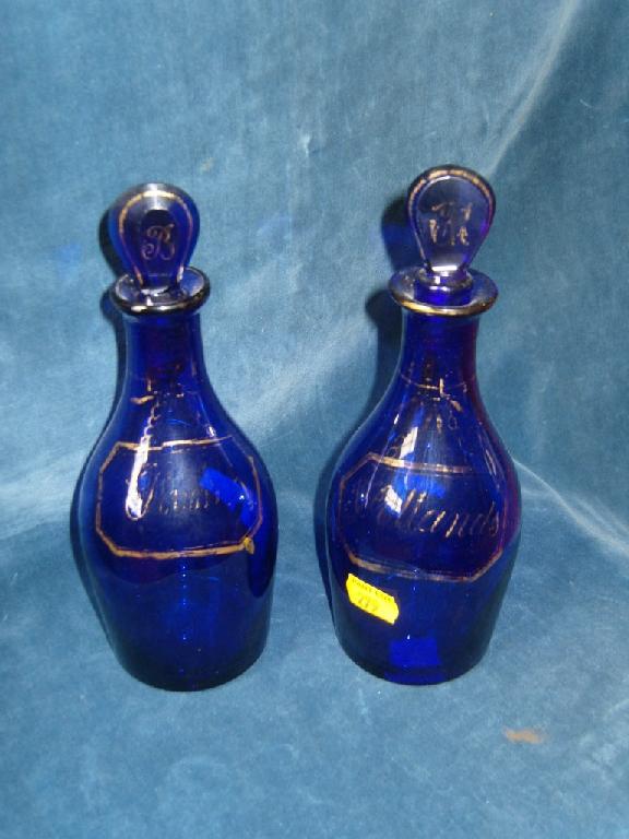 Appraisal: A pair of early th century blue glass decanters and