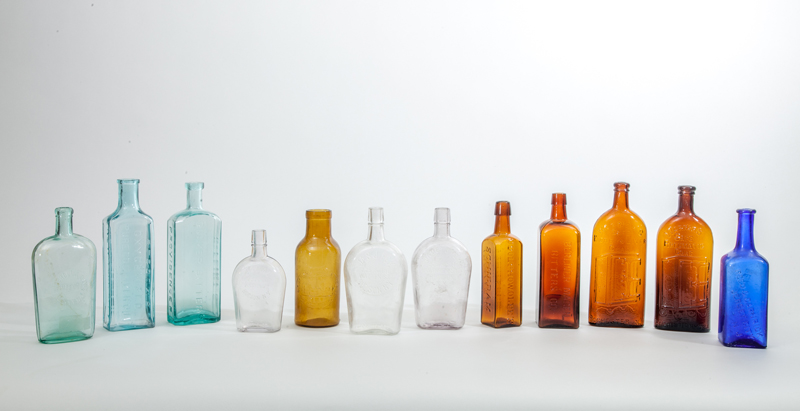 Appraisal: ASSEMBLED GROUP OF TWELVE GLASS BOTTLES Including two brown 'Warner's