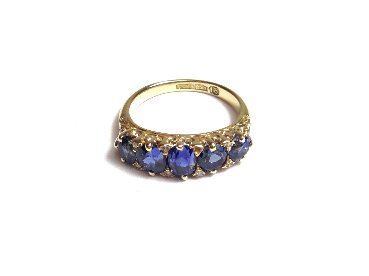 Appraisal: A gold and sapphire set five stone ring mounted with