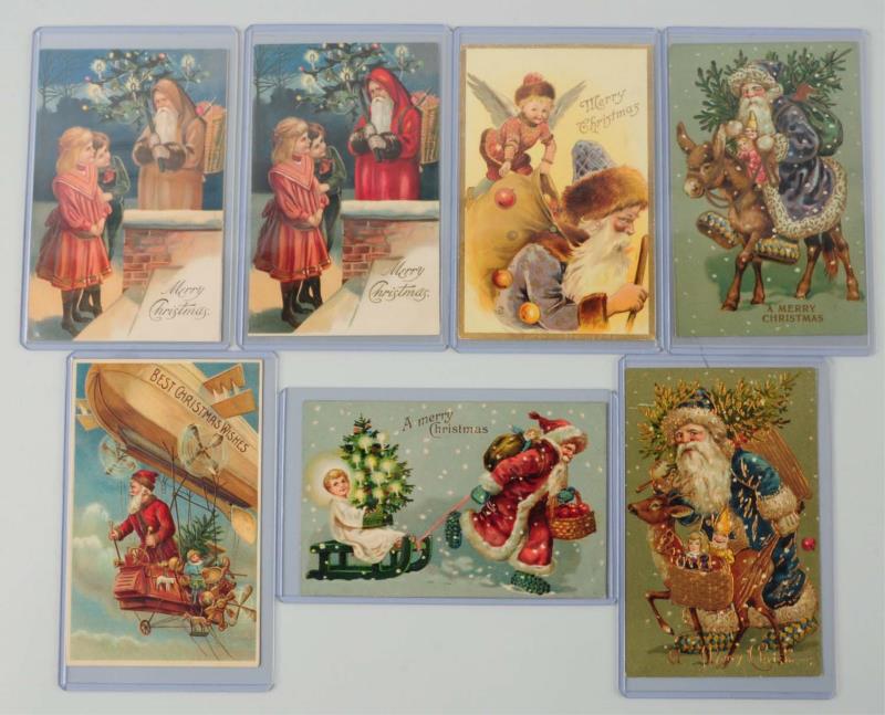 Appraisal: Lot of Santa Postcards Lot has one in blue robes