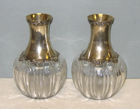 Appraisal: PAIR OF SILVER MOUNTED CUT GLASS BOTTLES Globular bodies with