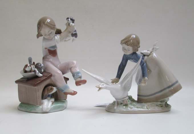 Appraisal: TWO LLADRO PORCELAIN FIGURINES Pick of the Litter by sculptor