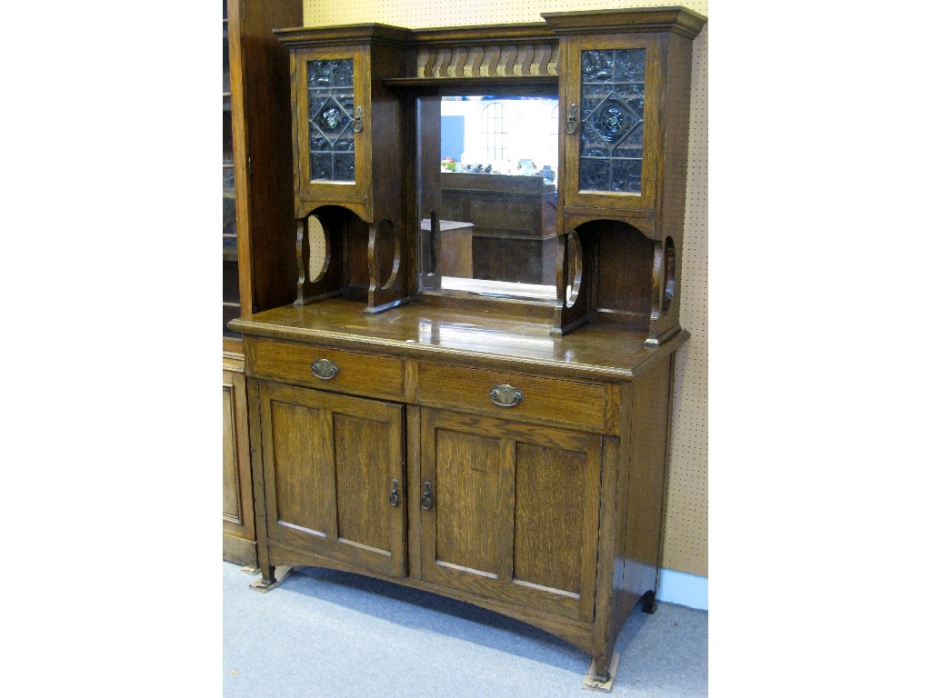 Appraisal: Arts and Crafts oak mirror back sideboard with leaded glass