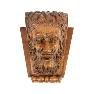 Appraisal: A mask head carving of a bearded man on a