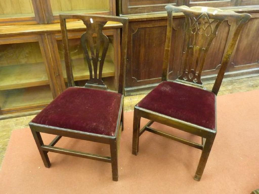 Appraisal: A pair of Chippendale style mahogany dining chairs with pierced