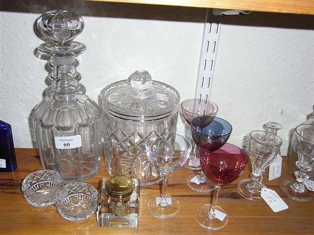 Appraisal: A GEORGIAN GLASS DECANTER a glass biscuit barrel coloured wine