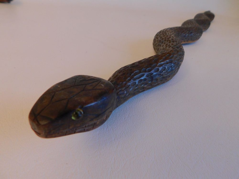 Appraisal: ANTIQUE CARVED WOOD SNAKE CANE Antique carved wood cane depicting