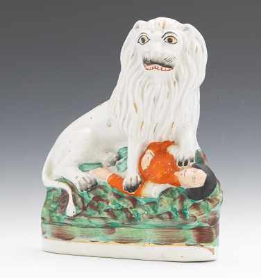 Appraisal: A Figural of The British Lion Over Napoleon Staffordshire figure