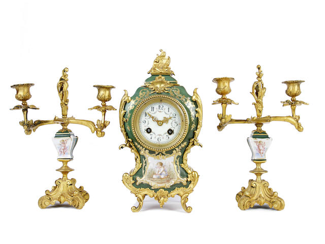 Appraisal: A French gilt-mounted porcelain clock garniture early th century The