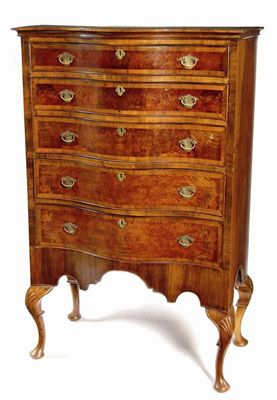 Appraisal: A walnut serpentine chest on stand in early th century