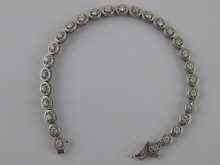 Appraisal: A white metal tests carat gold diamond line bracelet approx