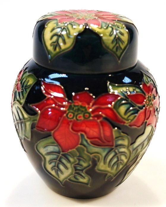 Appraisal: A Moorcroft Poinsettia pattern jar and cover of shouldered circular