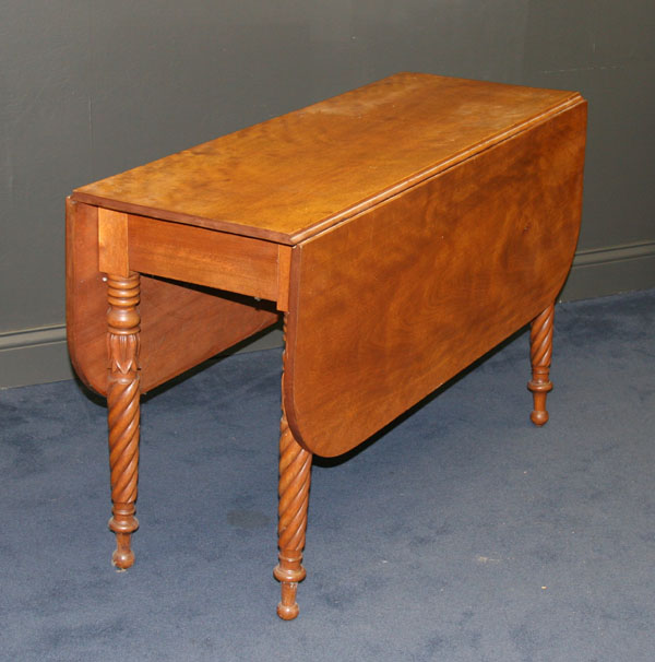 Appraisal: Drop leaf table turned legs with carved floral accents Closed